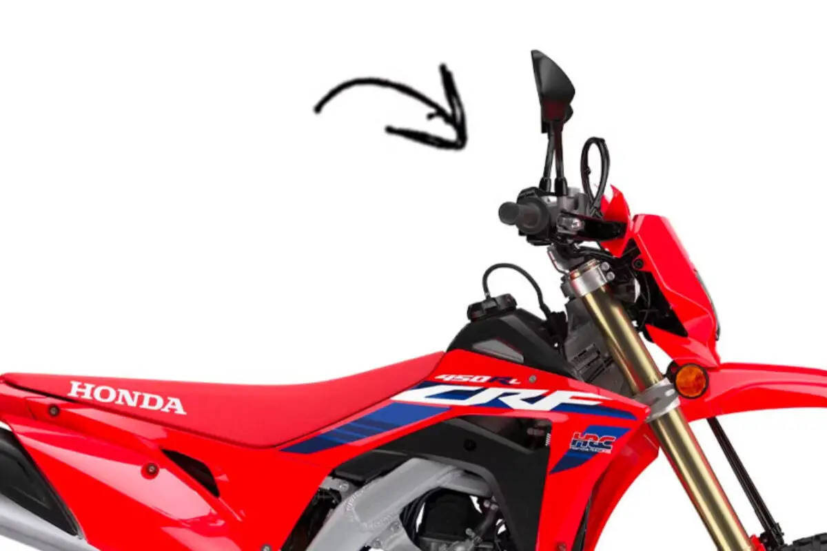 Arrow pointing at the electric start on a dirt bike