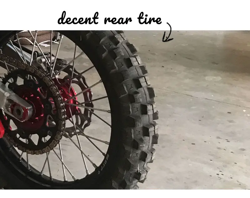 Arrow showing when to replace a rear dirt bike tire