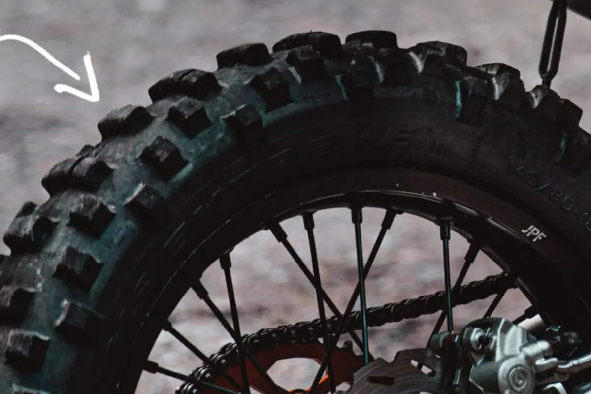 A worn-out dirt bike tire that needs replaced